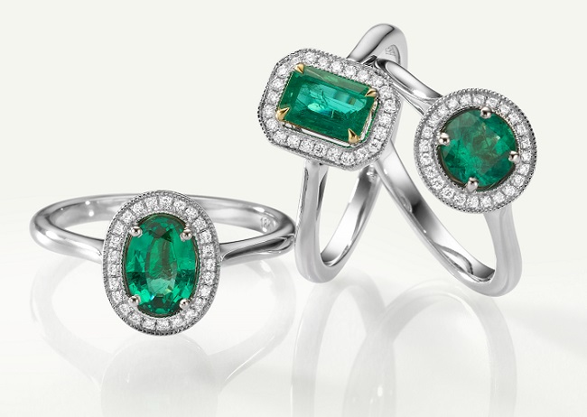 A pile of LEIBISH Emerald and Diamond halo rings